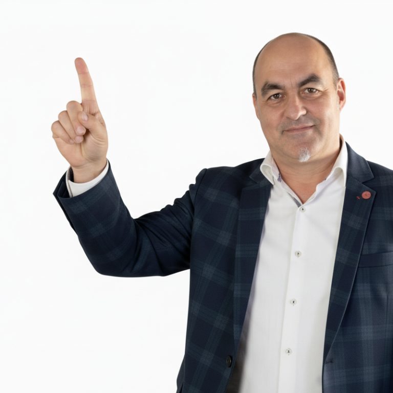 gestor seag Hombre con chaqueta de cuadros, levantando un dedo índice y sonriendo.